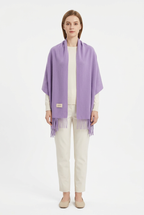Light Purple fringed scarf styled as a shawl on a full-length model